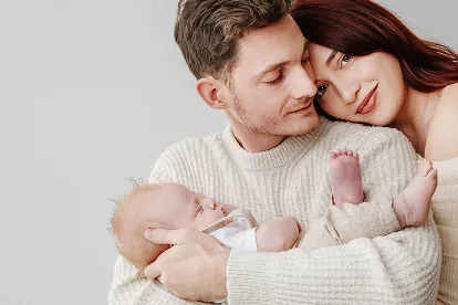 New parents holding their baby during a Verve newborn session